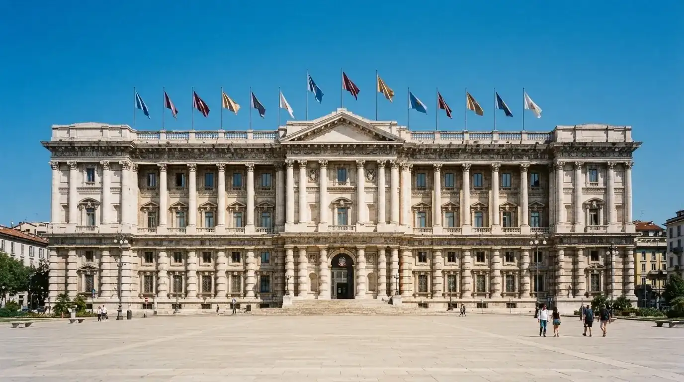 Palazzo istituzionale con bandiere al vento in una piazza soleggiata — casino deposito minimo 1, 5, 10 e 20 euro